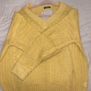 a cute yellow sweater. i’ve never worn it:)